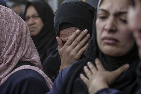 Palestinians mourn their dead at Deir Al Balah hospital after Israeli airstrike in central Gaza