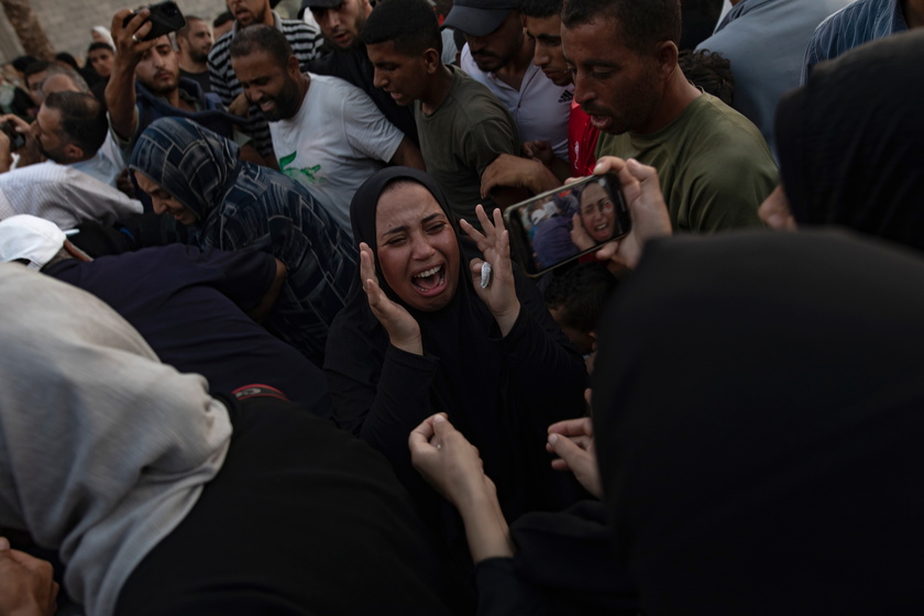 Palestinian families gather next to bodies at Nasser Hospital in Gaza